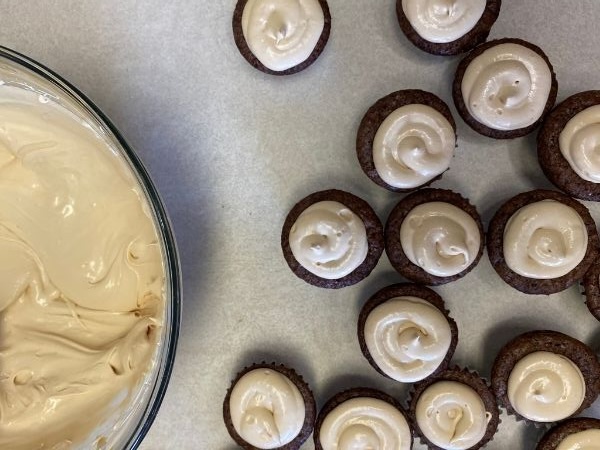 finished brownies topped with whipped caramel ganache