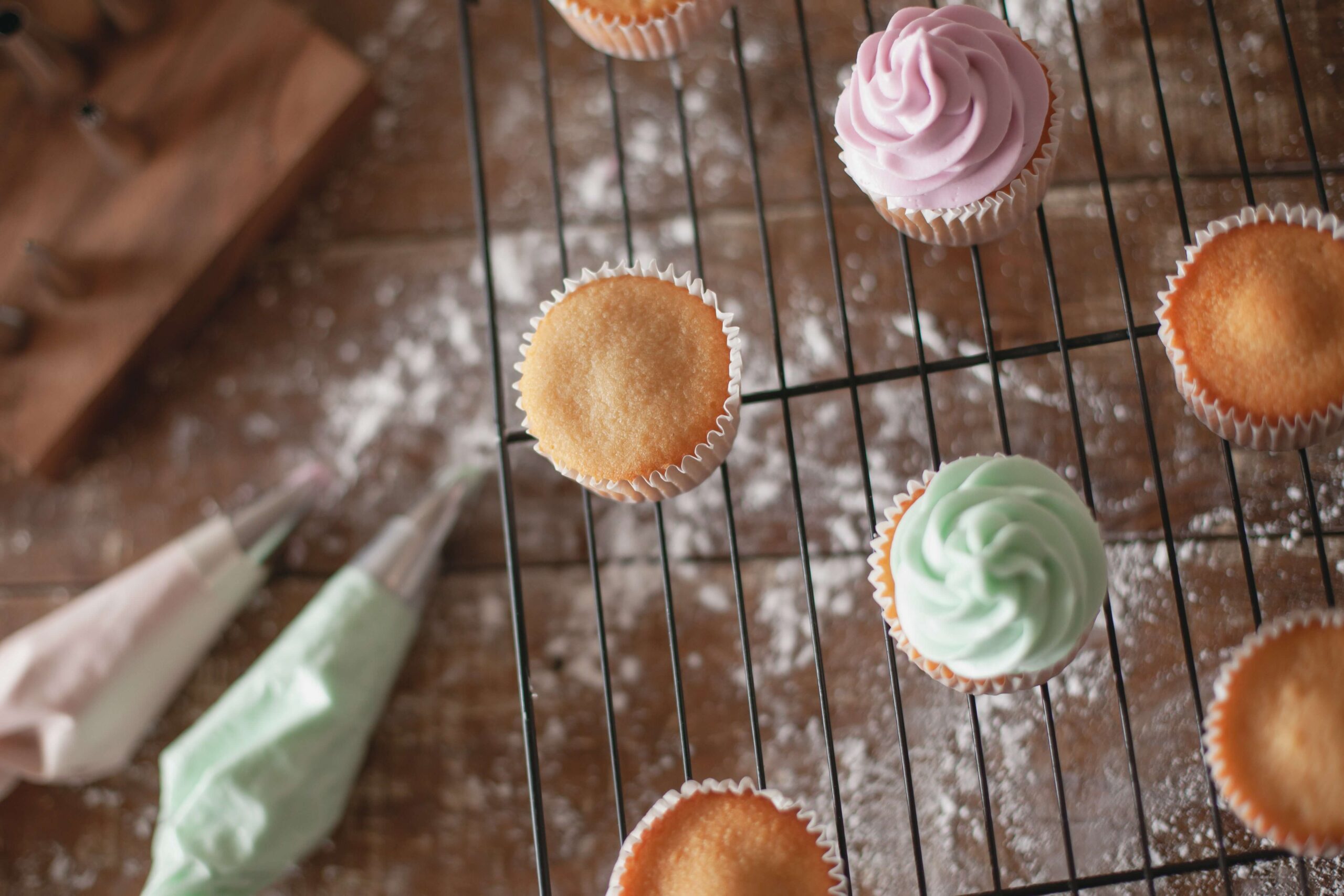 pipe frosting onto cupcakes to dress them up