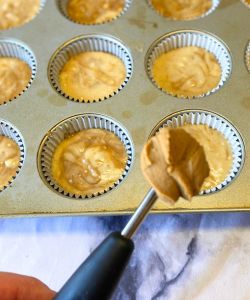 use a melon baller to add dollops of cookie butter to muffins