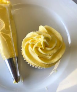 assemble dairy-free mango cupcakes with mango frosting