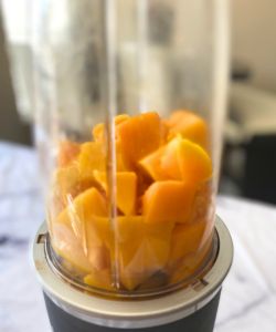 blend mangoes to make puree for frosting