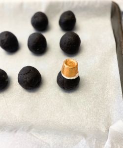 add rolo to top of christmas ornament oreo balls