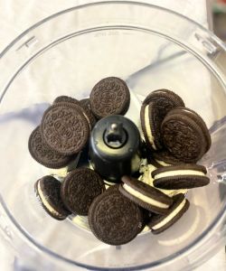 place oreos and cream cheese in food processor