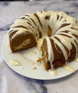 pumpkin spice cake with cream cheese filling and drizzle