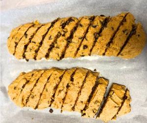 slice pumpkin chocolate chip biscotti after first bake