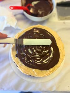 spread ganache on top of cake