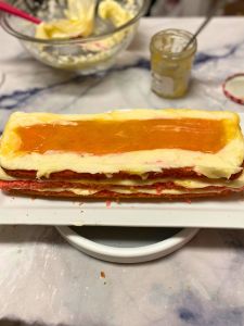 three layers of strawberry lemon rectangular layer cake decorated with fondant