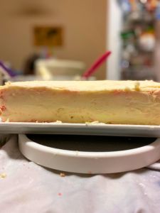 finished crumb coat strawberry lemon rectangular layer cake decorated with fondant