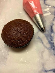 frosting in piping bag easy chocolate cupcakes recipe wifh coffee and raspberry buttercream