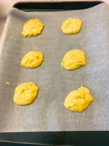 spread out rounded amounts of dairy-free banana whoopie pie batter on cookie sheet