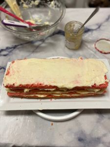 smooth top layer of strawberry lemon rectangular layer cake decorated with fondant