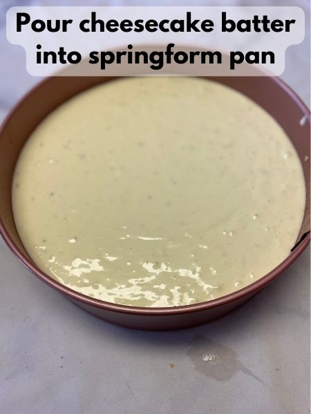 pour cheesecake batter into pan