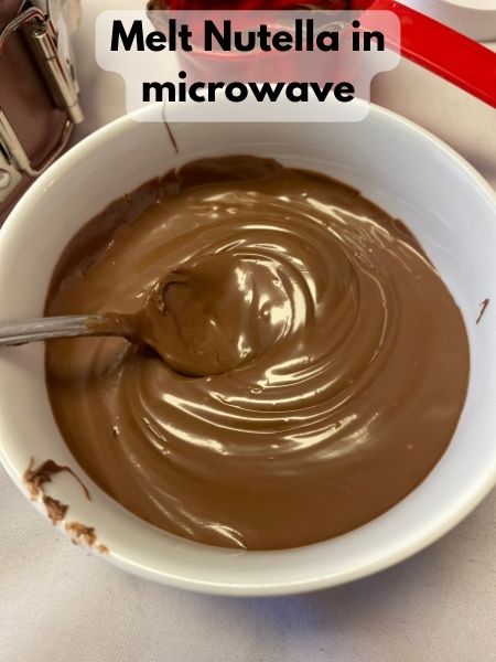 melt Nutella in microwave for a few seconds