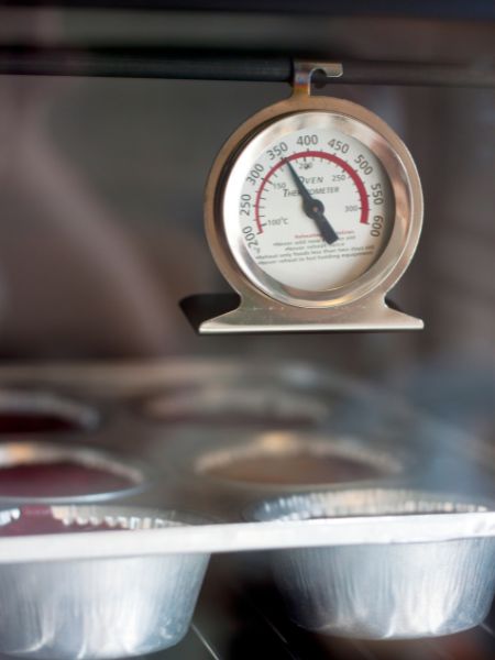 oven thermometer showing temperature for baking soft fluffy sugar cookies