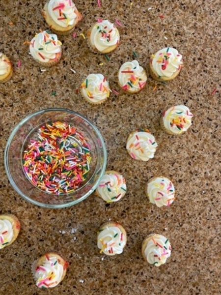 finished mini cupcakes with rainbow sprinkles