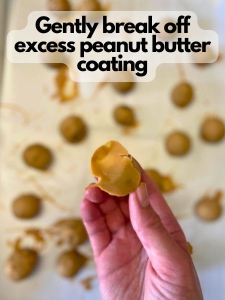 gently break off extra peanut butter after it hardens