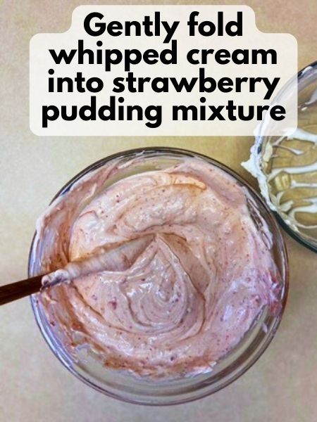 fold whipped cream into strawberry and pudding mixture