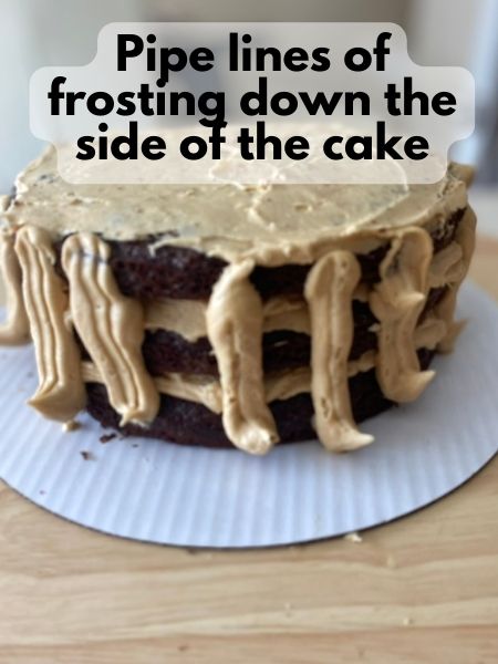 pipe lines of frosting down sides of cake