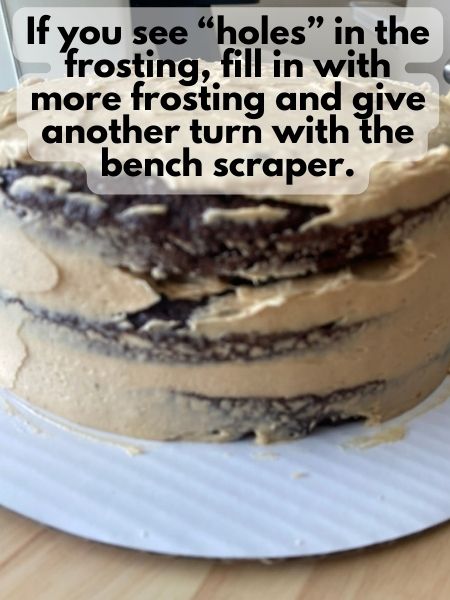 look for holes in the frosting and fill in