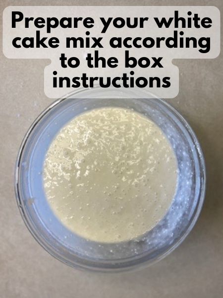 prepare white cake mix according to box instructions