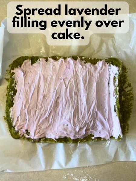 spread lavender frosting on top of matcha cake