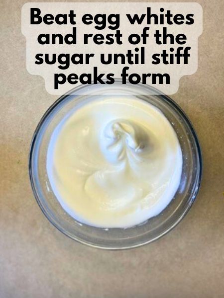 beat egg whites and other half of sugar until stiff peaks form