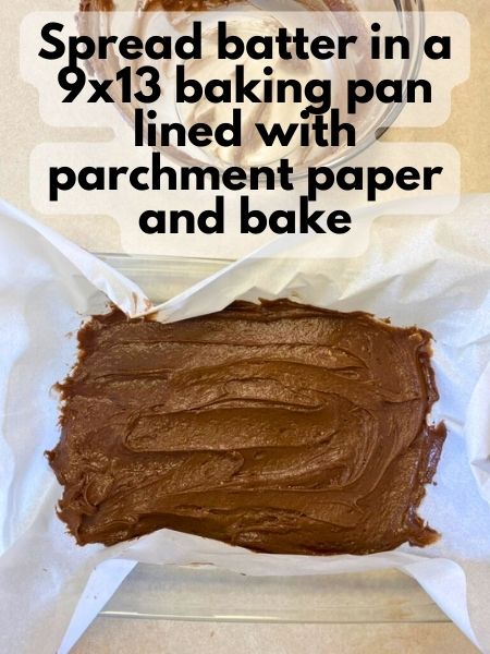 spread brownie batter in pan lined with parchment paper