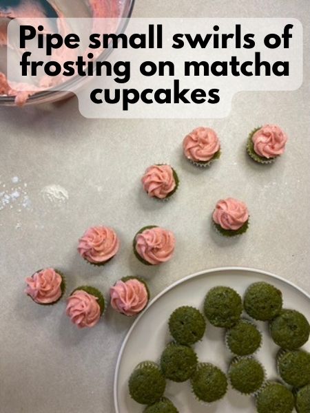 pipe frosting onto cupcakes