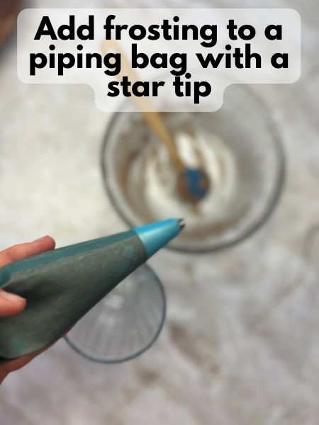 add frosting to a piping bag with a star tip