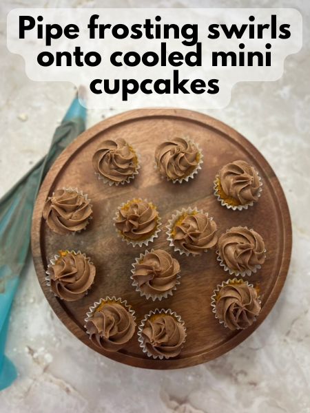 pipe frosting onto cooled mini cupcakes