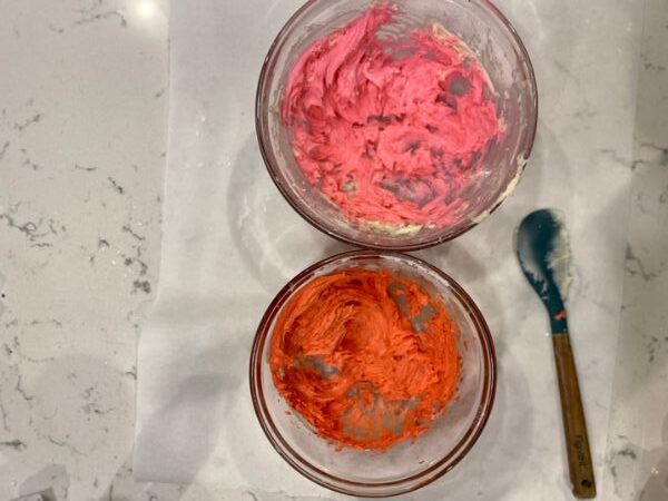 divide frosting into bowls and color