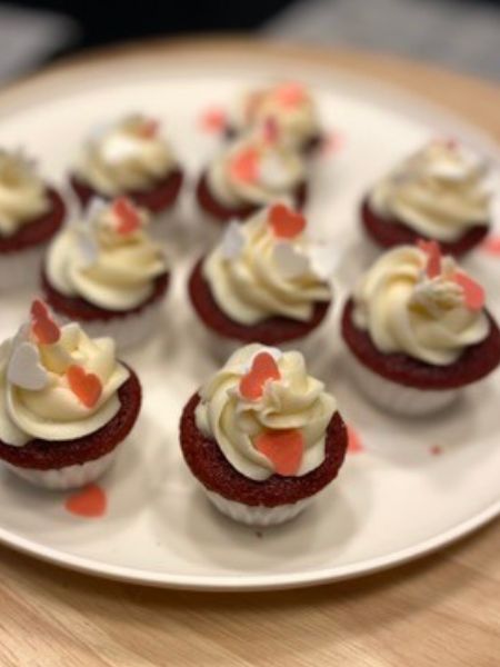 mini red velvet cupcakes with heart sprinkles