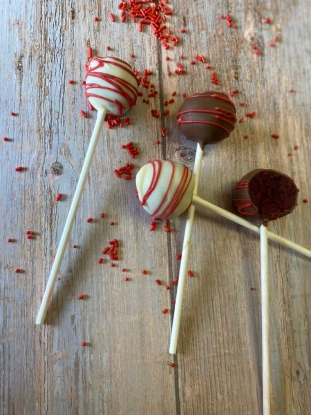 red velvet cake pops with a chocolate coating