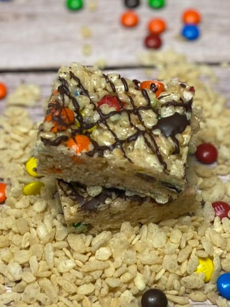 rice krispie treats with browned butter, m&m's and chocolate drizzle