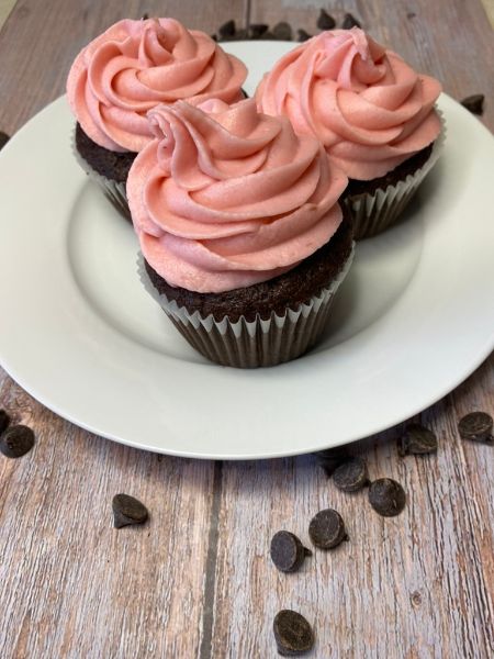 chocolate cupcakes with raspberry frosting and chocolate ganache filling