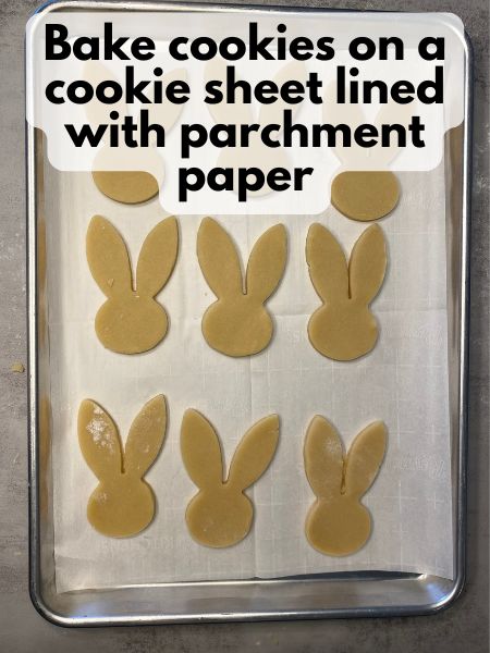 place cut out cookies on baking sheet lined with parchment paper and bake