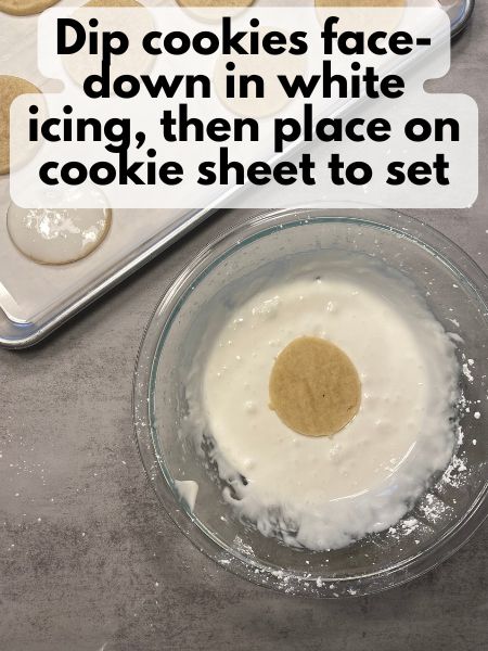 place cookies face-down in white icing