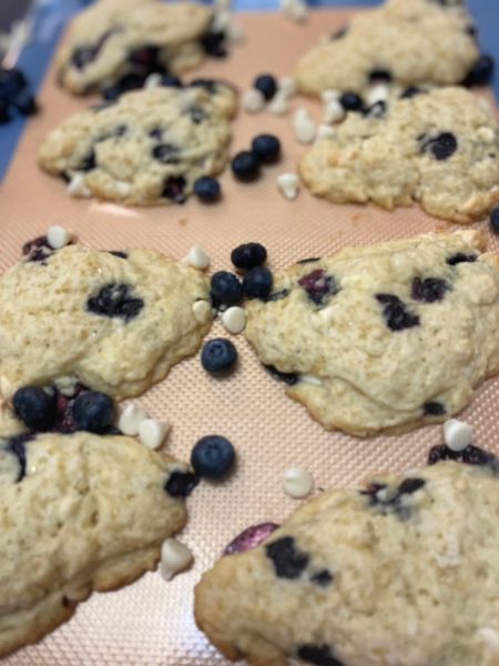 blueberry white chocolate scones on a baking sheet