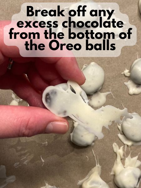 break off excess chocolate from bottom of Easter egg Oreo balls