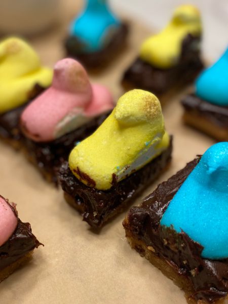 Peeps smores bars with peeps marshmallows on top, chocolate filling and a graham cracker crust