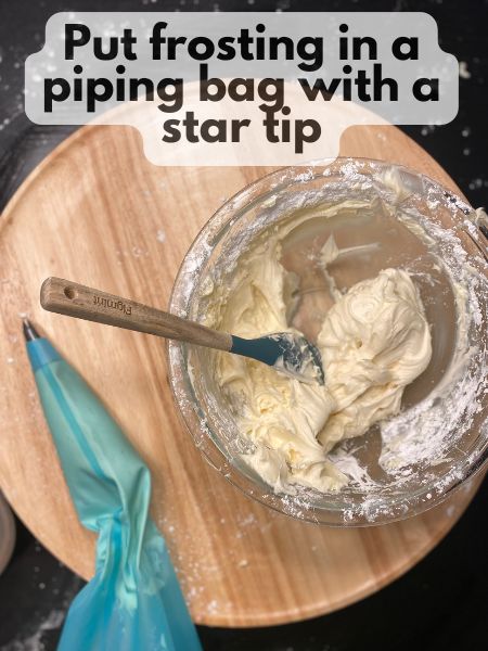 put frosting in a piping bag with a star tip