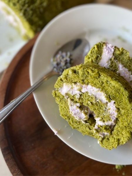 matcha roll cake slice with a lavender pastel purple filling