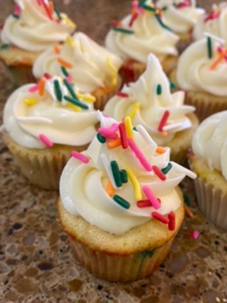 mini cupcakes decorated with colorful sprinkles