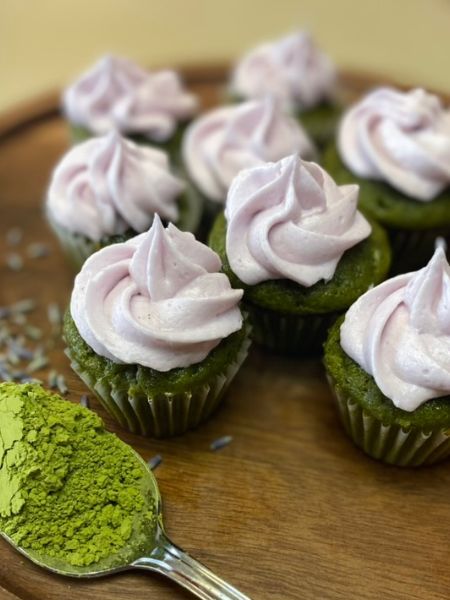 mini matcha cupcakes with a swirl of lavender frosting on top