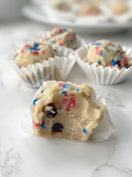cookie dough balls with red and blue sprinkles and mini chocolate chips