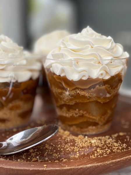 parfaits layered with graham cracker crumbs, apple pie filling, dulce de leche and whipped cream