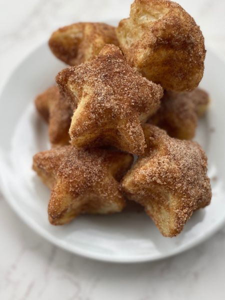fluffy puff pastry coated in cinnamon sugar and shaped like stars