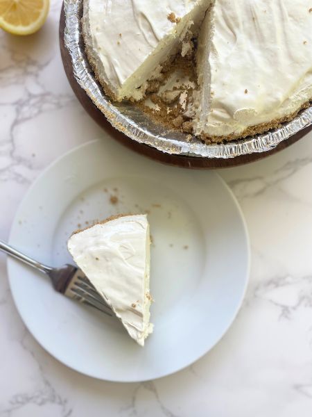 slice of frozen lemonade pie on a plate
