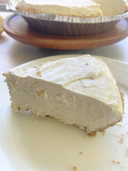 a slice of frozen lemonade pie on a plate