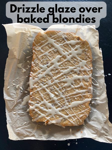maple glaze drizzled on top of maple pecan blondies